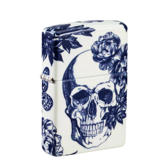 Zippo windproof lighter featuring a blue floral skull design on a white glow in the dark finish