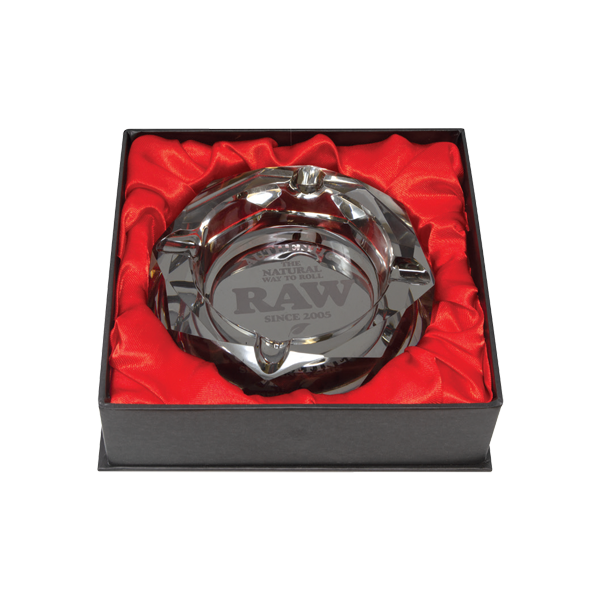 RAW The Dark Side glass ashtray showing a sleek, dark-colored design with the RAW logo embossed on the surface.