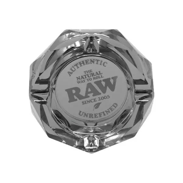 RAW The Dark Side glass ashtray showing a sleek black design with a circular shape and indentation for cigarette rests.