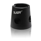 Raw magnetic metal cigarette snuffer attached to a metal ashtray, designed for safely extinguishing and storing cigarette butts.